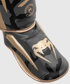 Venum Elite Shin Guards - Dark Camo/Gold -Boxing Elegant Butikk SHINGUARD ELITE 3.0 BLACK GOLD 1500 03 2